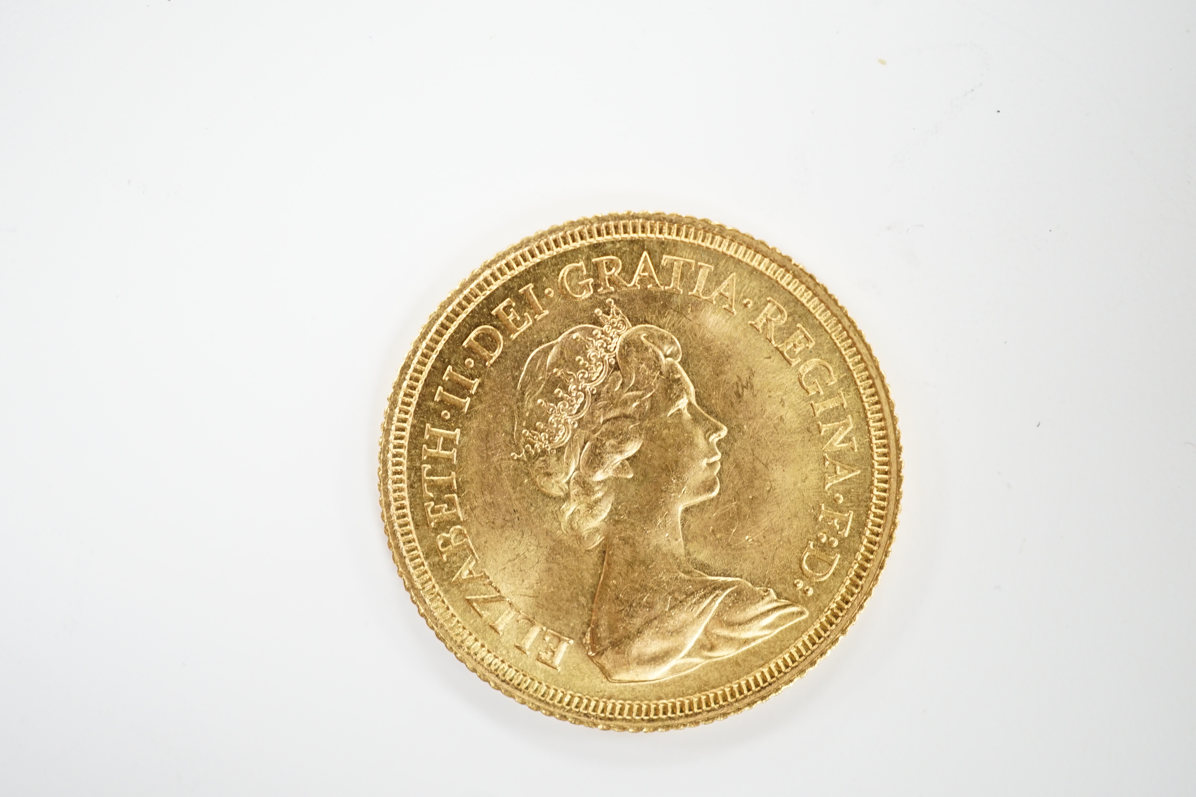 An Elizabeth II 1974 gold sovereign.